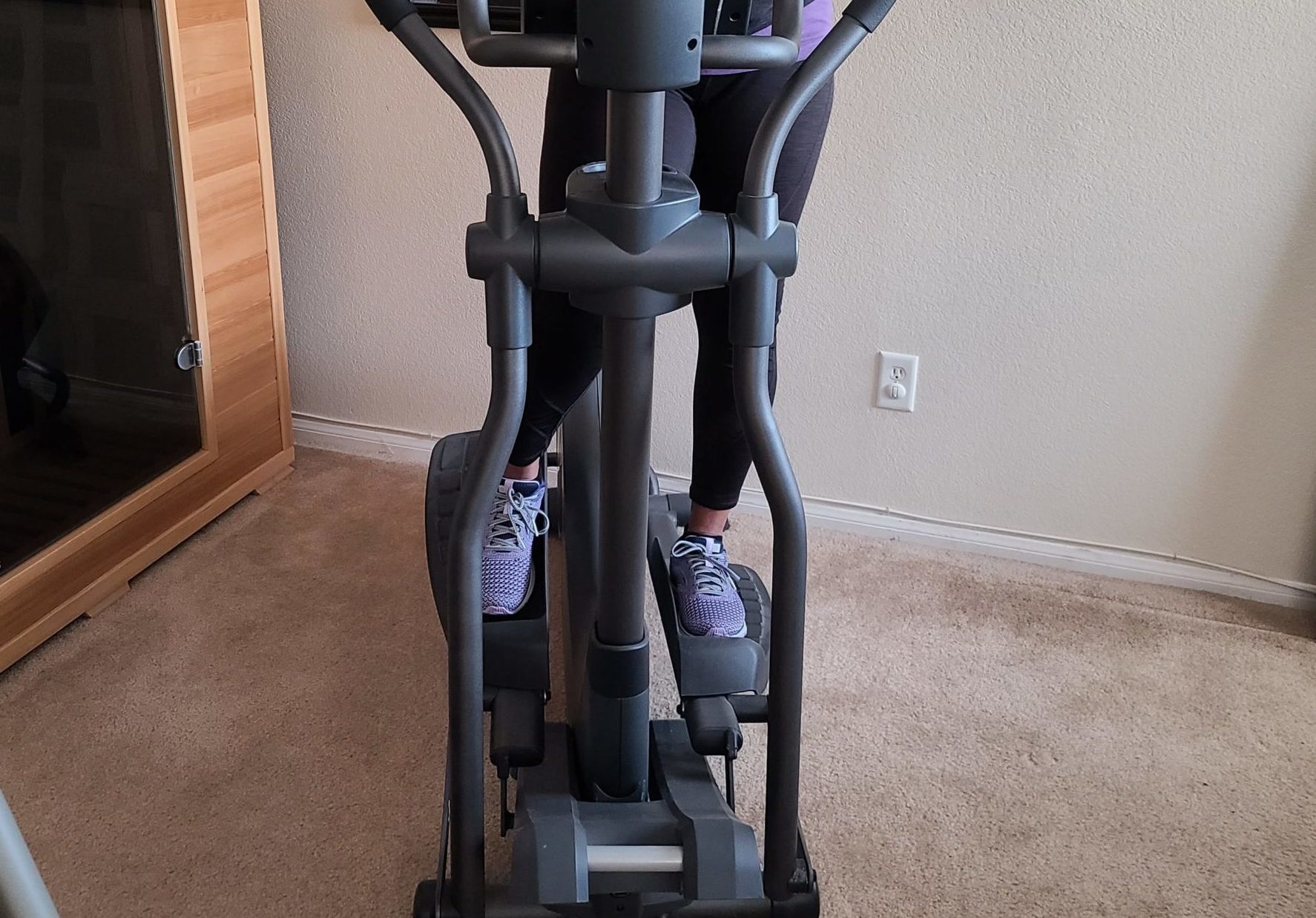 Woman on elliptical for a short person
