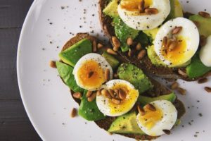 eggs with yolk and avocado toast