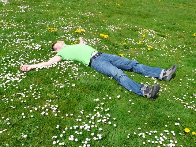 Man laying in grass